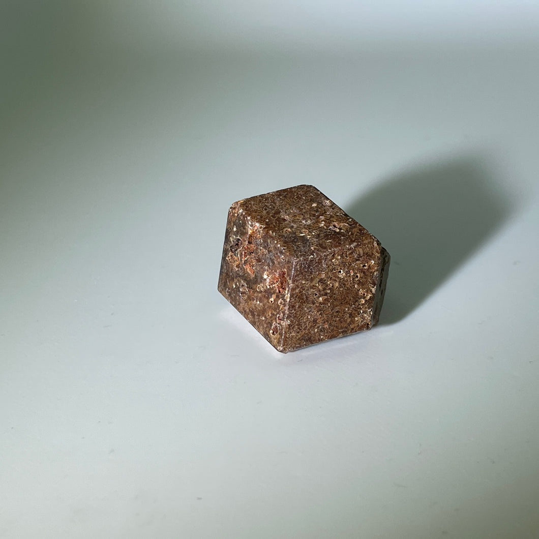 Orange skin black center garnet from Mali, Africa